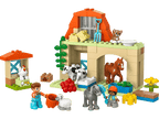 Toddler child hand independently attaching an oversized DUPLO block to the stable roof facade