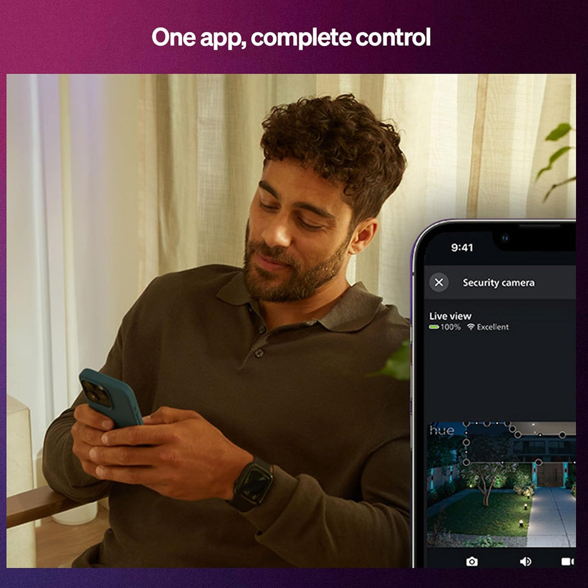 The two Philips Hue color ambiance bulbs glowing vividly in a modern smart living room automation setup