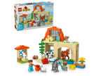 Close up of the 8 included LEGO DUPLO animal figures standing outside the farmhouse gate doors