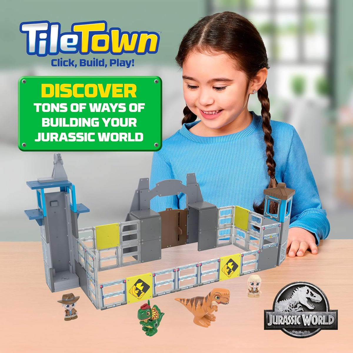 A child using the manual magnetic elevator tile to raise a character figure up the Jurassic World gate tower