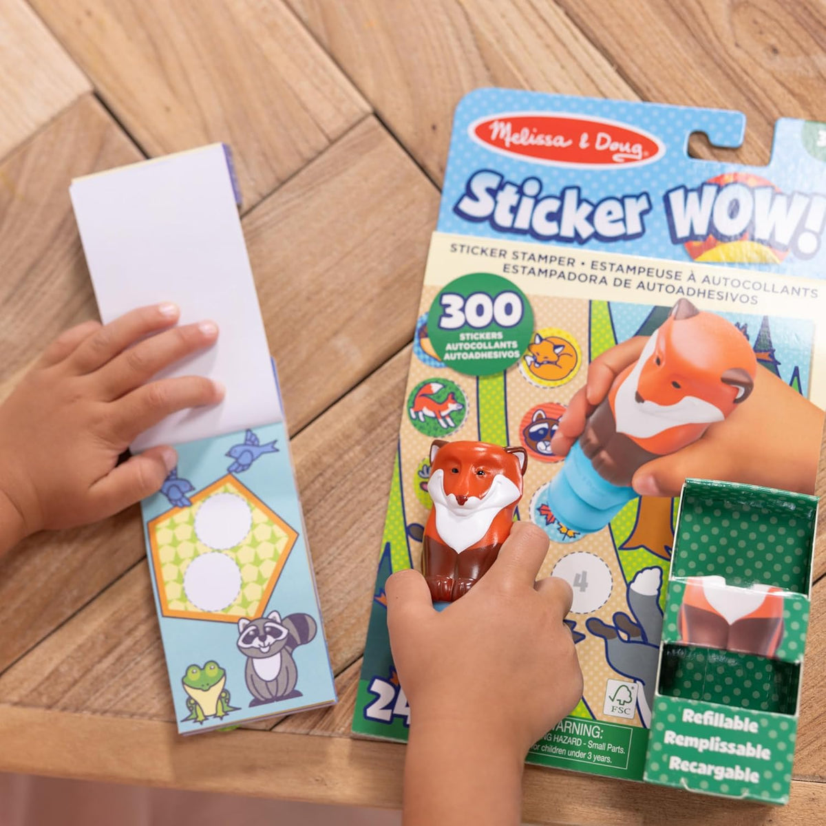 The spiral bound Melissa and Doug activity pad showcasing the built in storage dock holding the fox stamper